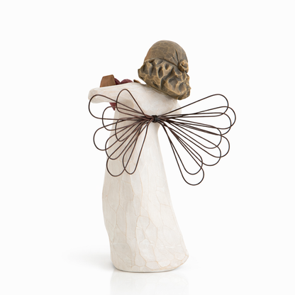 With Love Angel figurine holding a red heart as a heartfelt love gift
