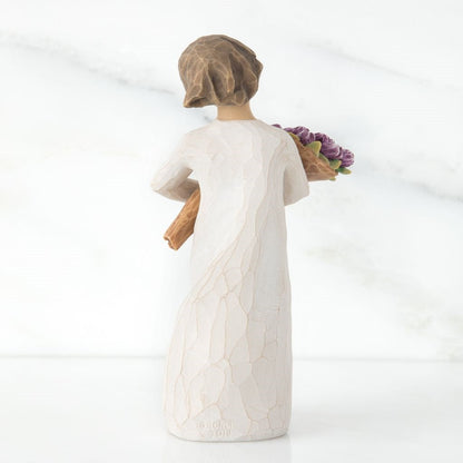 Surprise Figurine holding flowers as a wonderful wishes keepsake gift